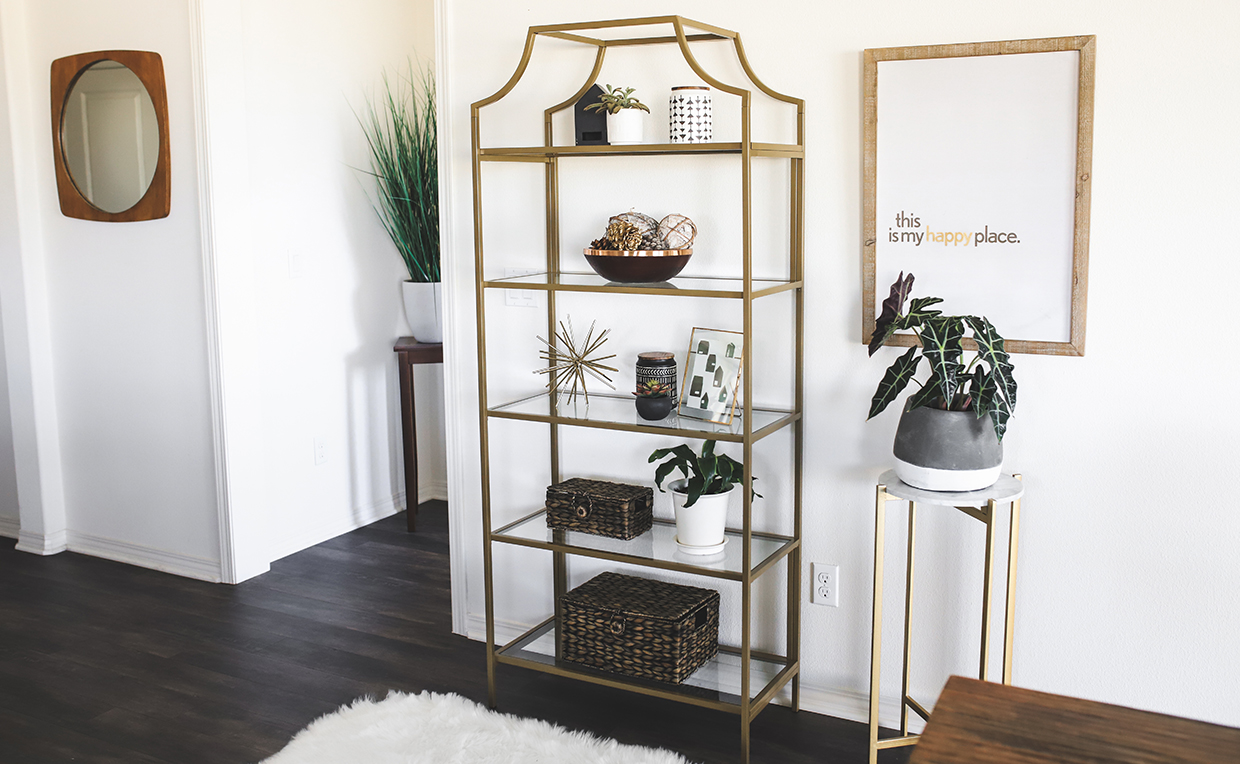 Blog_Amanda_1240x764_06.jpg Gold metal and glass tower bookcase in dining room