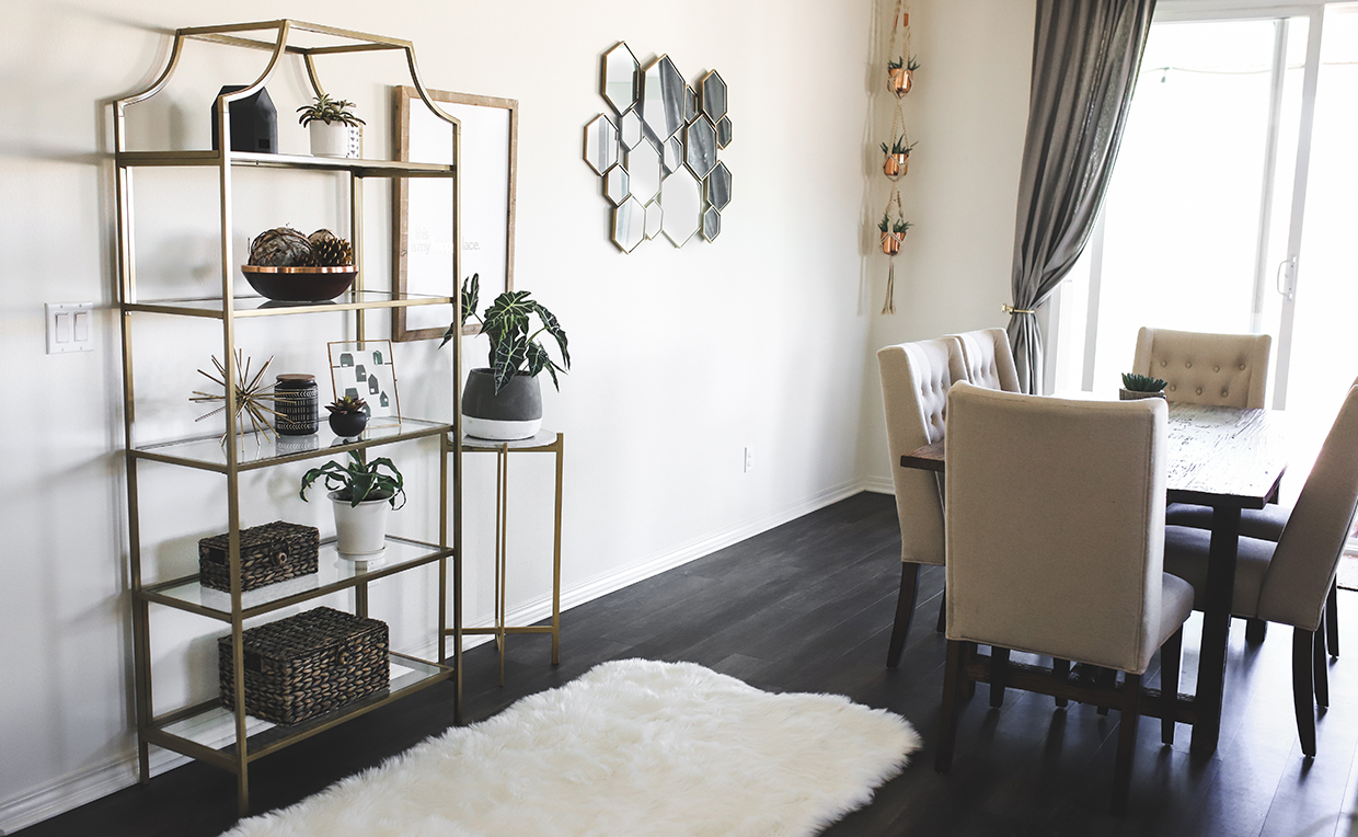 Blog_Amanda_1240x764_09.jpg Gold metal and glass tower bookcase in dining room