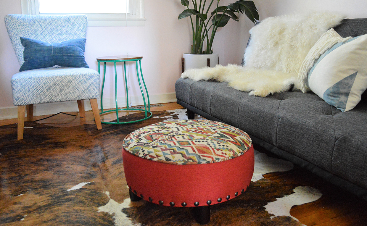 Blog9_1240x764_04.jpg Den with couch, sheepskin blanket, chair and ottomans